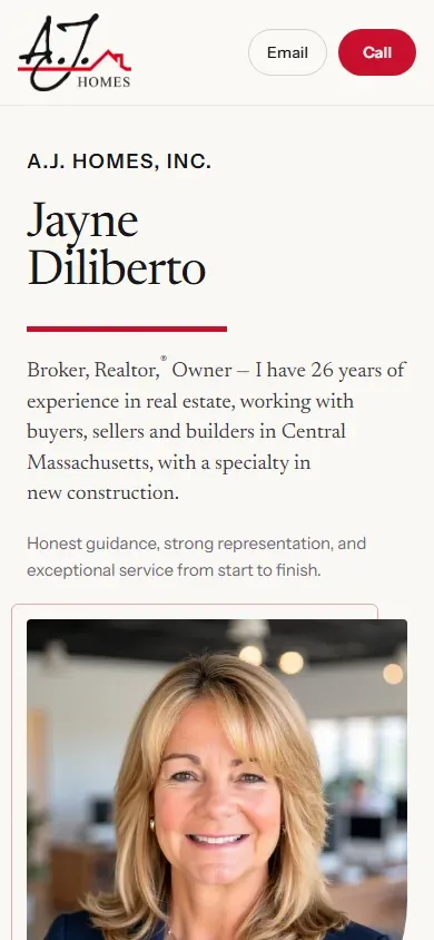 The real estate broker website for A.J. Homes Realty shown on a phone