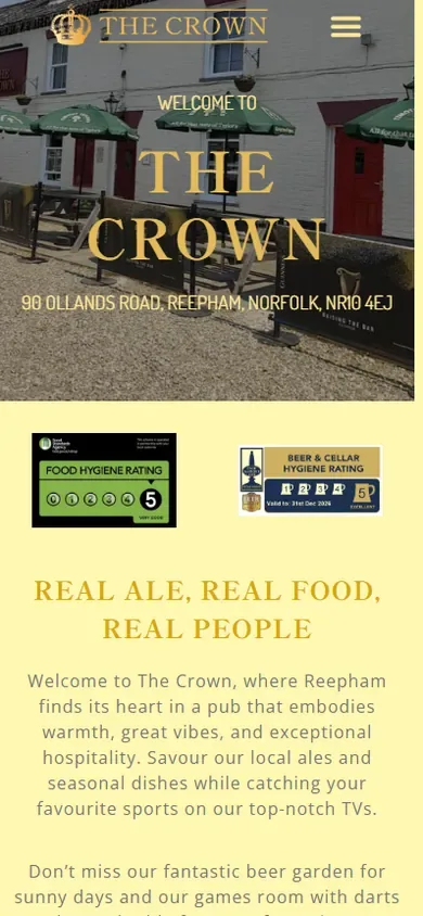 The pub website for The Crown Reepham shown on a phone
